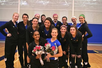 The Varsity Volleyball girls gather before the match to honor their seniors. 