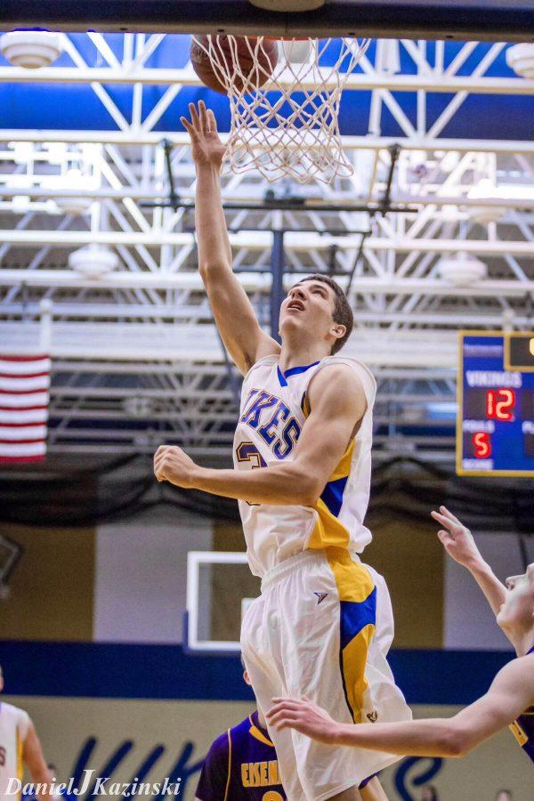 Senior Scott Reichel completes a layup as the Vikings are defeated by Ike. 
