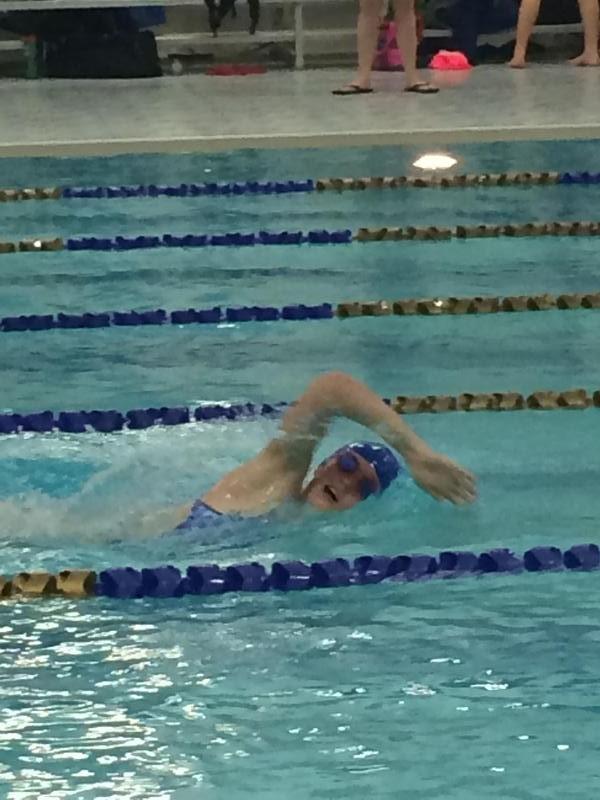 Sophomore Rachel Rasmussen swims the 4x100 freestyle, leading to a varsity win.