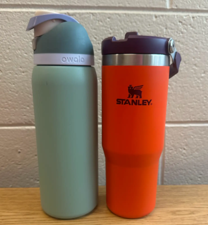 Owala water bottle (left) next to a Stanley water bottle (right)
