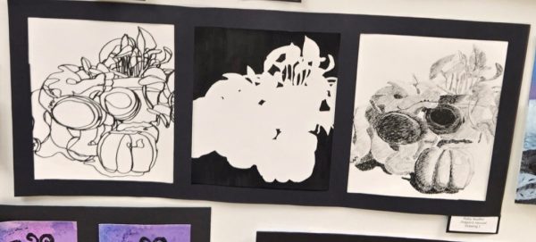 This is an example of the still life project from the Drawing One class. This shows three different types of still lifes, including contour line, negative space, and hatching. The piece shown is called "Dragon's Harvest" and was made by Ryley Nuoffer.